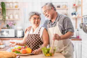 Happy senior couple in kitchen