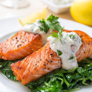 salmon filets over greens