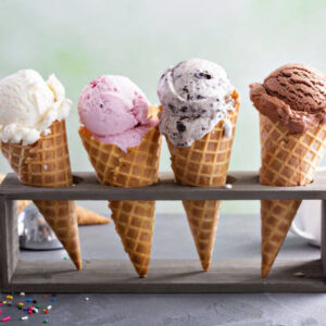 Variety of ice cream scoops in cones